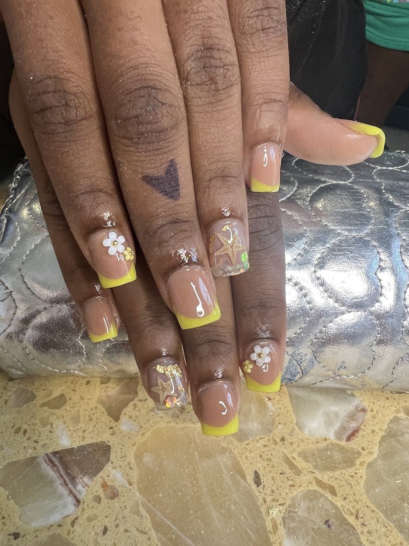Nail salon station with manicure tools and polish bottles.