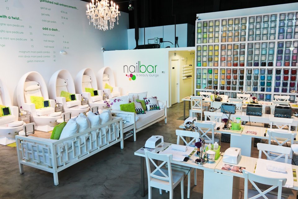 Beauty bar interior with chairs and tidy work surfaces.
