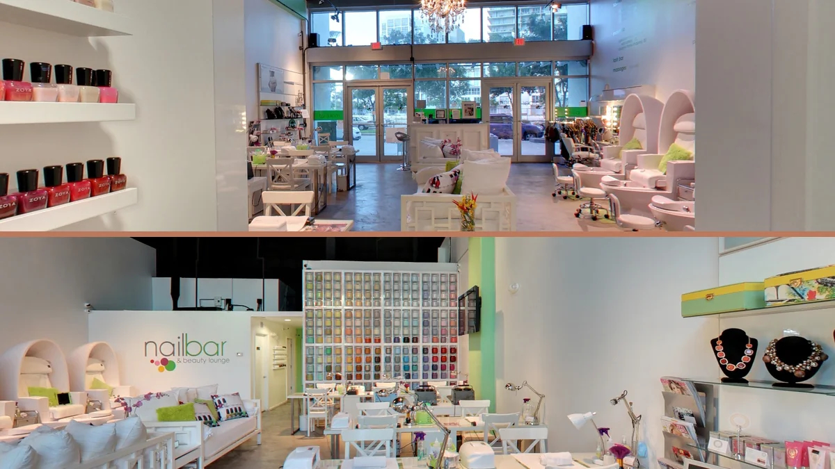 Nail salon station with manicure tools and polish bottles.
